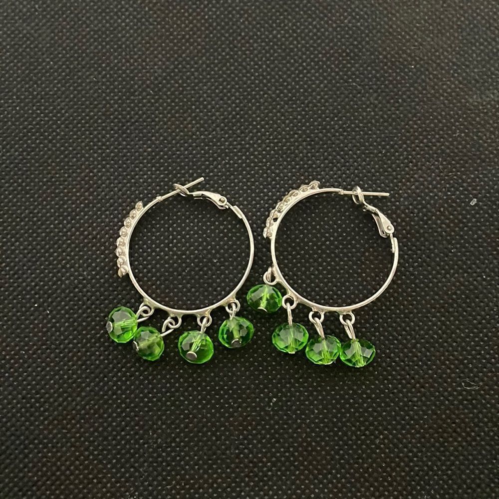 Small hoop earrings with green rhinestones